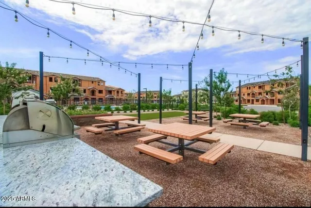 a view of a backyard with sitting area