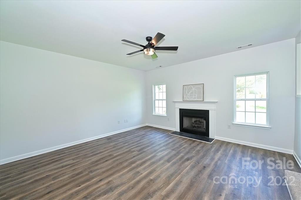675 Winding Branch Road Rock Hill, SC 29732 - Photo 14 of 34 wooden floor fireplace and windows in an empty room