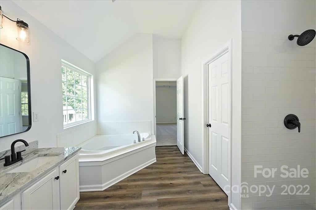 675 Winding Branch Road Rock Hill, SC 29732 - Photo 24 of 34 a bathroom with a tub sink and mirror