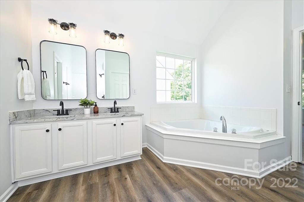 675 Winding Branch Road Rock Hill, SC 29732 - Photo 25 of 34 a bathroom with a double vanity sink mirror and bathtub