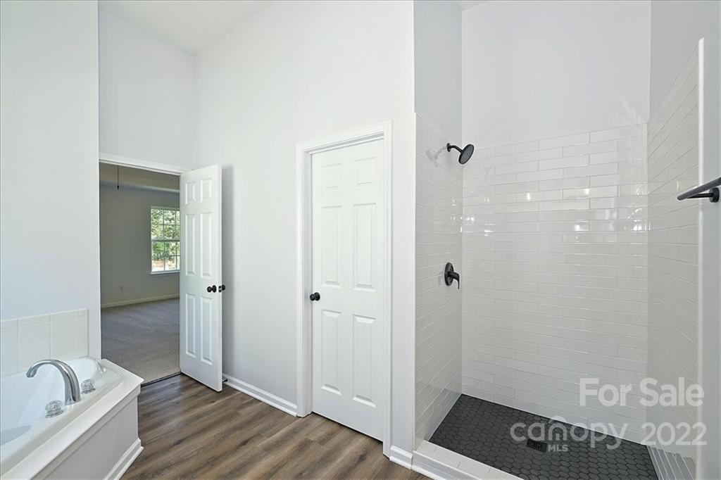 675 Winding Branch Road Rock Hill, SC 29732 - Photo 27 of 34 a bathroom with a tub and shower