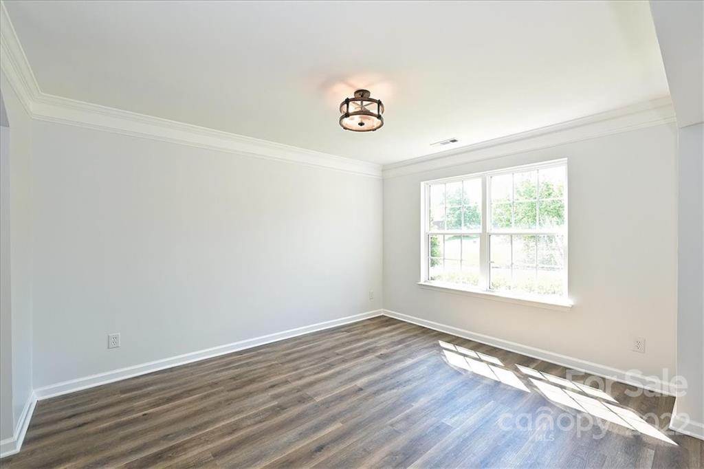 675 Winding Branch Road Rock Hill, SC 29732 - Photo 3 of 34 an empty room with wooden floor and windows