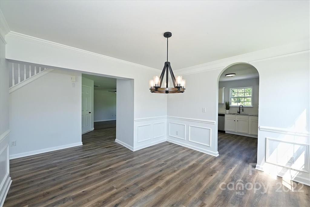 675 Winding Branch Road Rock Hill, SC 29732 - Photo 5 of 34 a view of a room with wooden floor and a ceiling fan