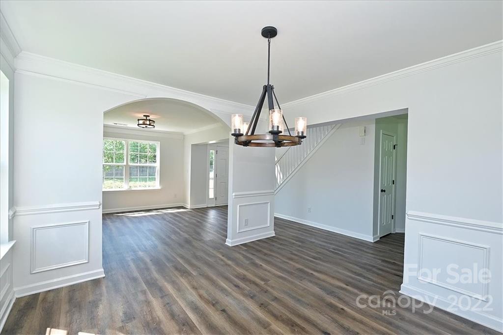 675 Winding Branch Road Rock Hill, SC 29732 - Photo 6 of 34 a view of a room with wooden floor and a ceiling fan