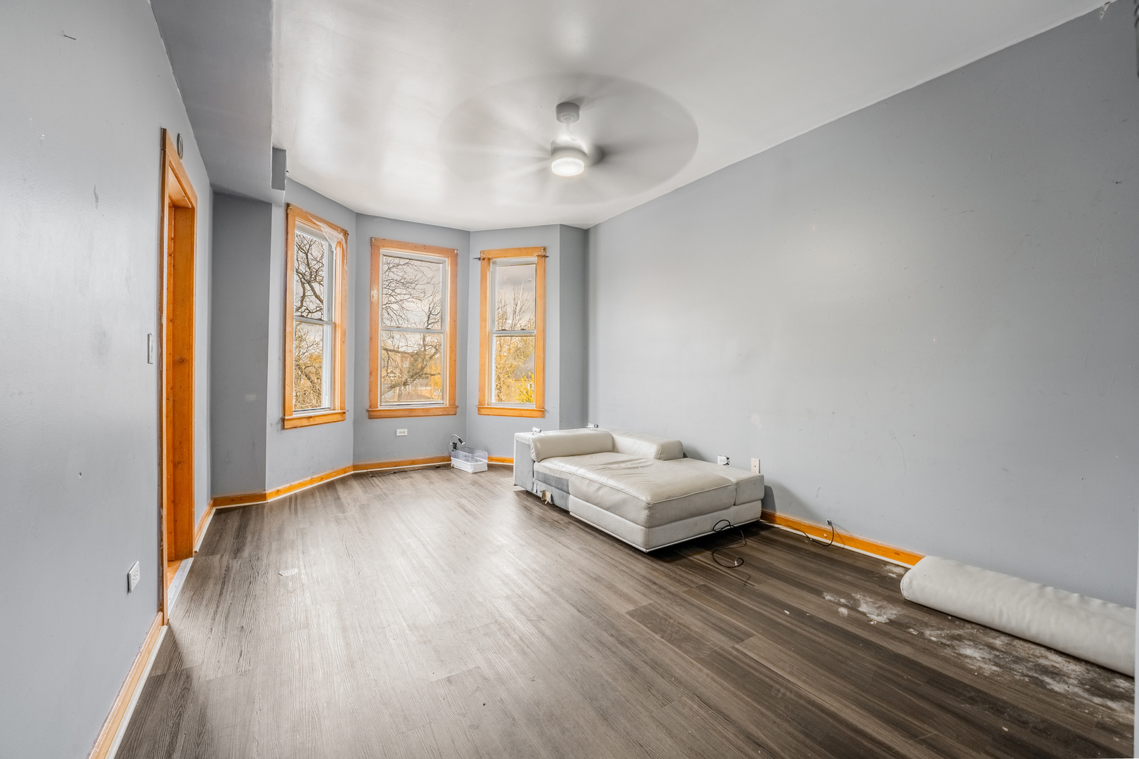 5338 South Wood Street Chicago, IL 60609 - Photo 11 of 22 a living room with hard wood floors and a window