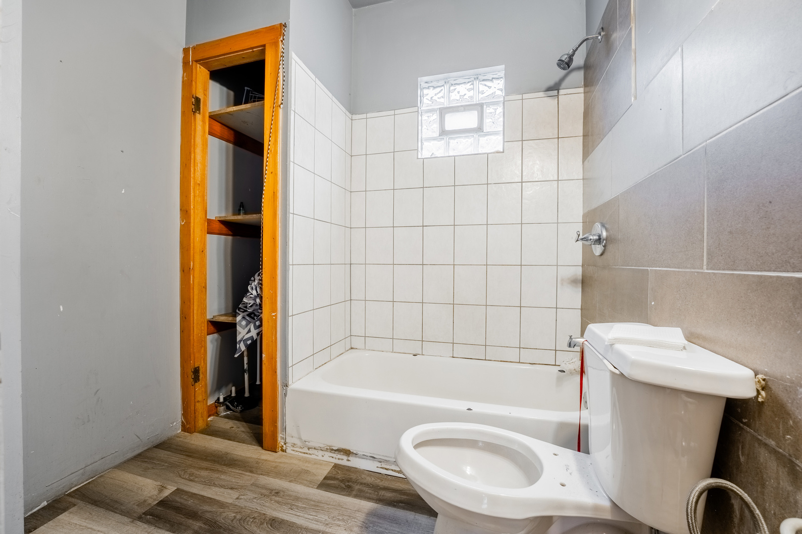 5338 South Wood Street Chicago, IL 60609 - Photo 13 of 22 a bathroom with a sink a toilet and shower