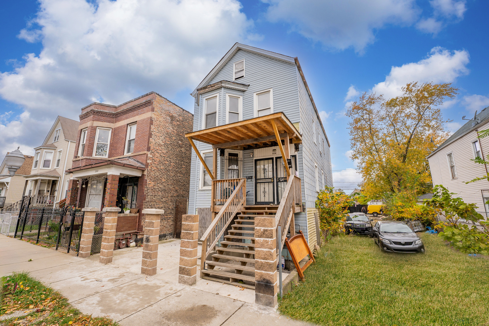 5338 South Wood Street Chicago, IL 60609 - Photo 2 of 22 a view of a brick house with many windows next to a road
