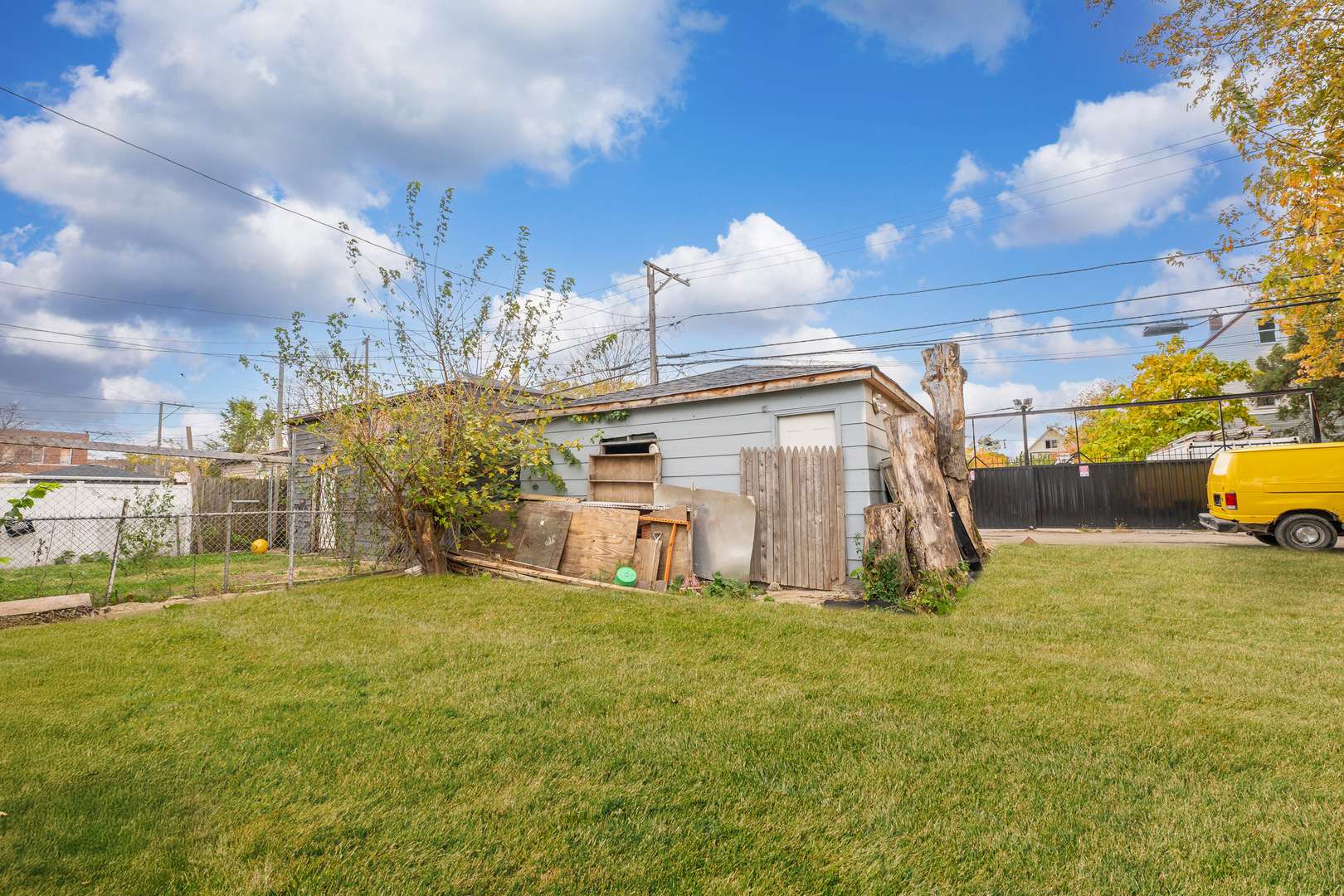 5338 South Wood Street Chicago, IL 60609 - Photo 22 of 22 a view of a back yard of the building and cars parked