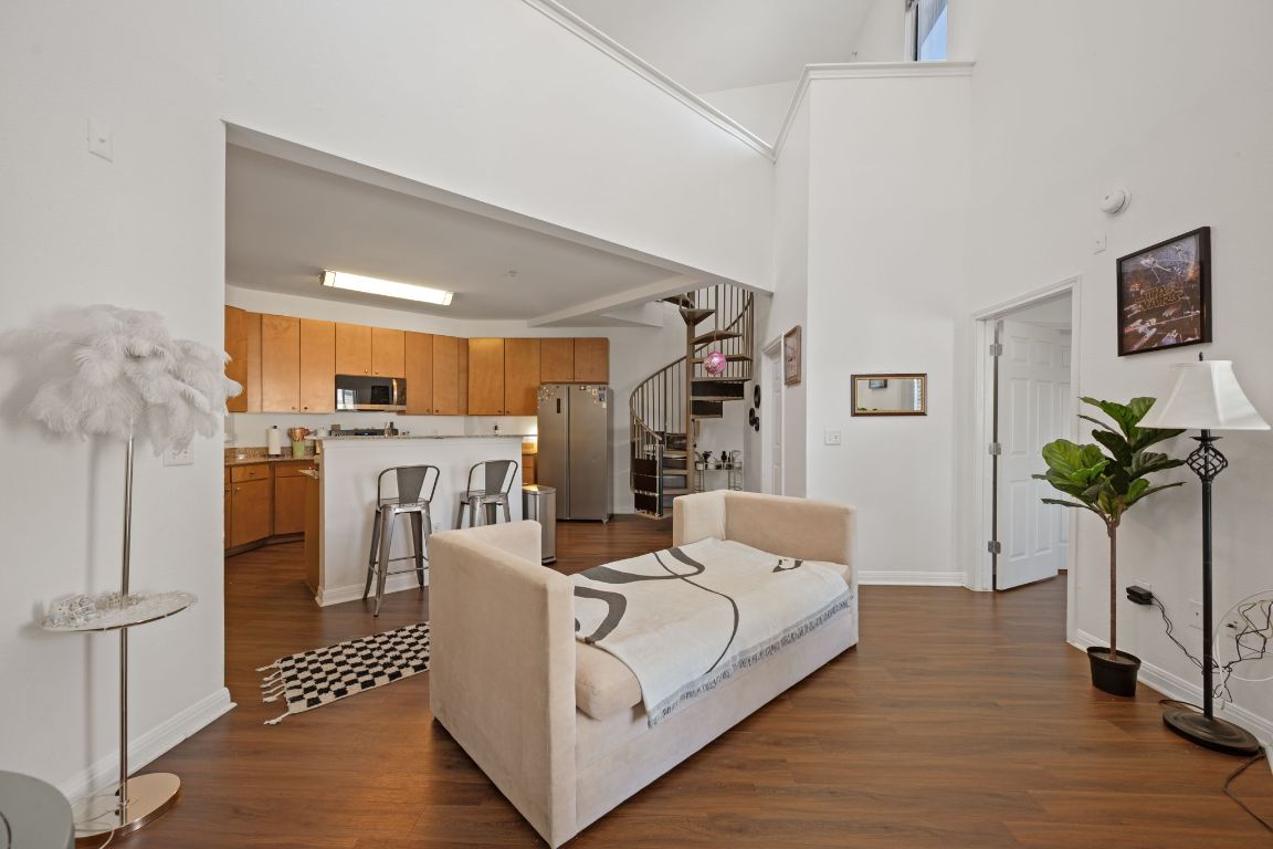 a living room with furniture and a potted plant