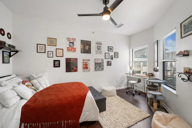 a living room with furniture and view of kitchen