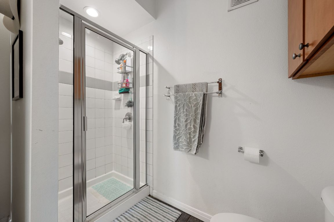 2502 Leon Street, Unit 511 Austin, TX 78705 - Photo 15 of 27 a bathroom with a shower and a sink