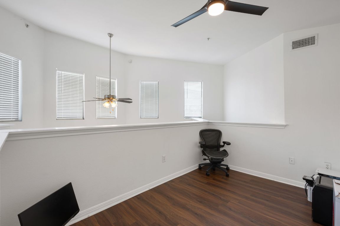 2502 Leon Street, Unit 511 Austin, TX 78705 - Photo 16 of 27 a view of a workspace with furniture and a window