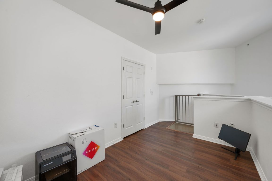 2502 Leon Street, Unit 511 Austin, TX 78705 - Photo 17 of 27 a view of a room with wooden floor and white walls