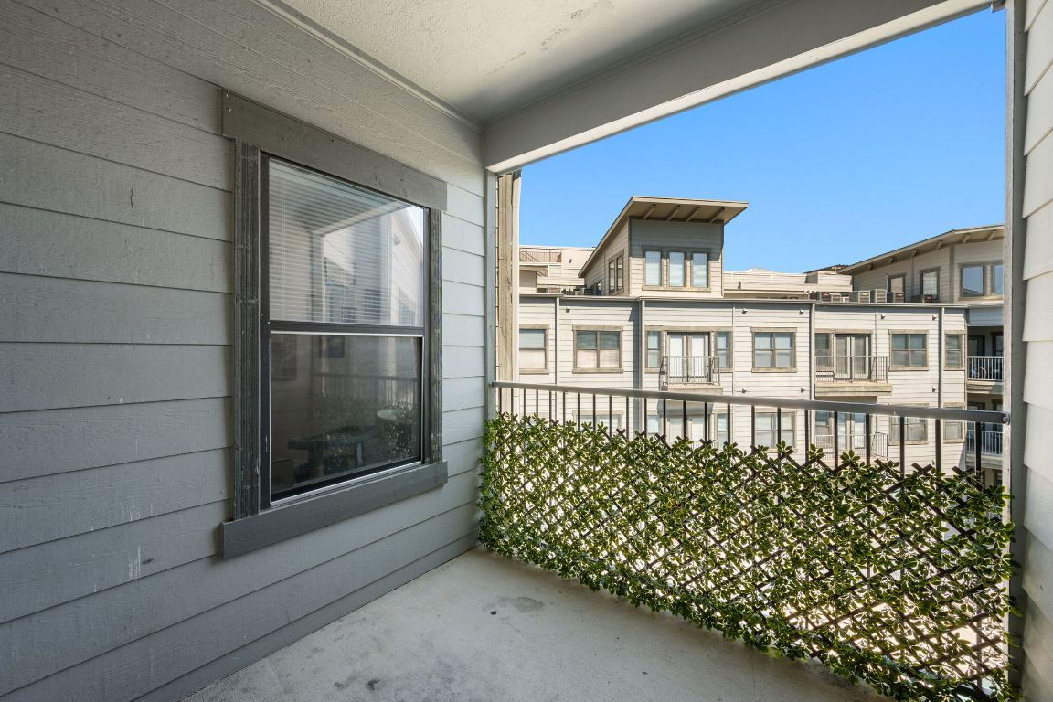 2502 Leon Street, Unit 511 Austin, TX 78705 - Photo 19 of 27 a front view of a house with a garden