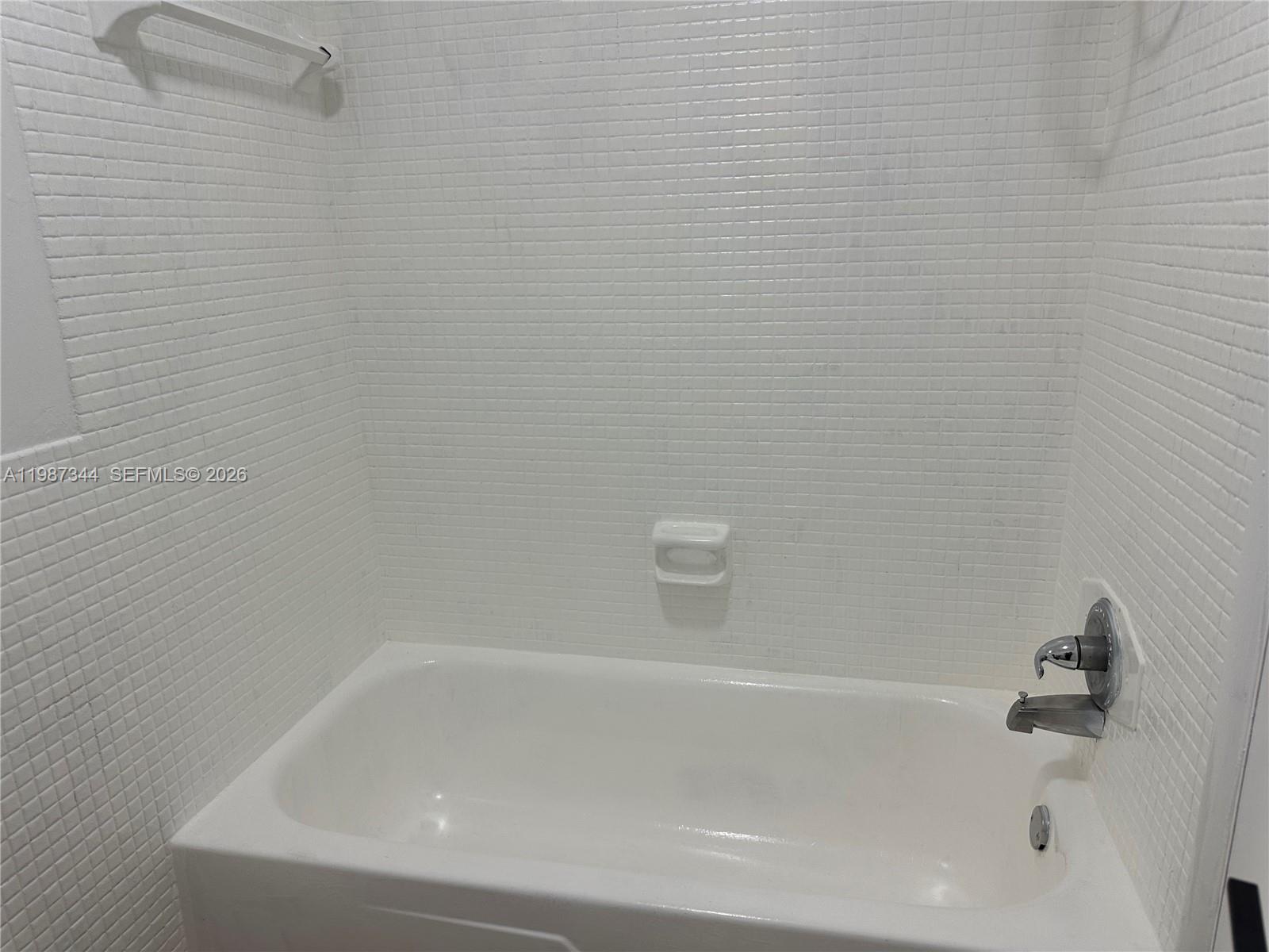 7670 Southwest 82nd Street, Unit H215 Miami, FL 33143 - Photo 5 of 9 a close up of a bathtub