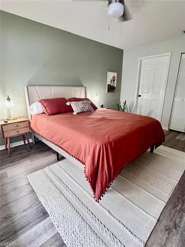 a bedroom with a bed and closet