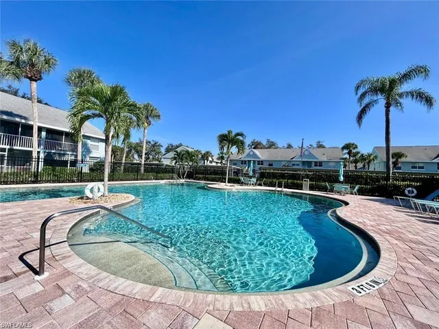 a view of a swimming pool with a patio