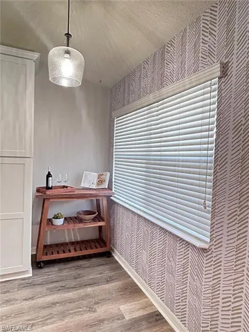 a room with a table and chairs