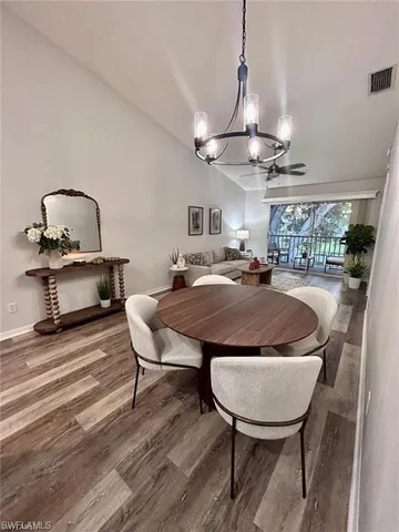 a bed room with furniture and a chandelier
