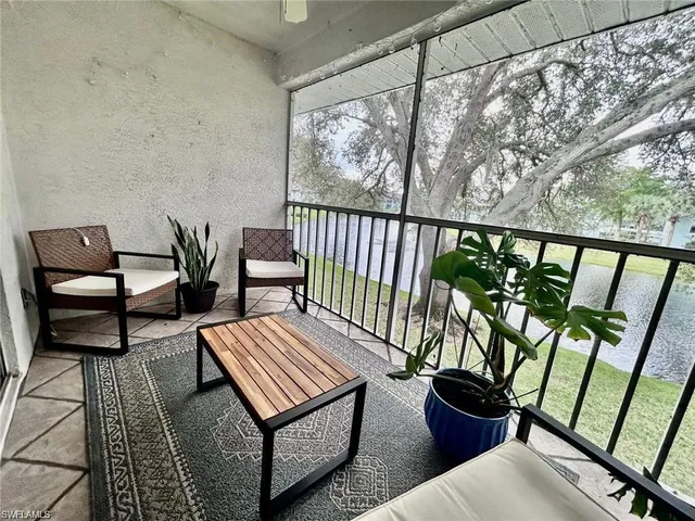 a view of a two chairs in the balcony