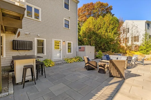 a view of a patio with table and chairs and potted plants