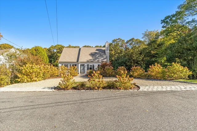 aerial view of a house with yard swimming pool and outdoor seating