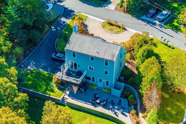 aerial view of a house with yard swimming pool and outdoor seating