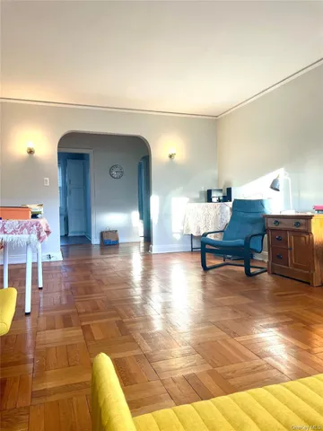 a room that has a window and a table in it