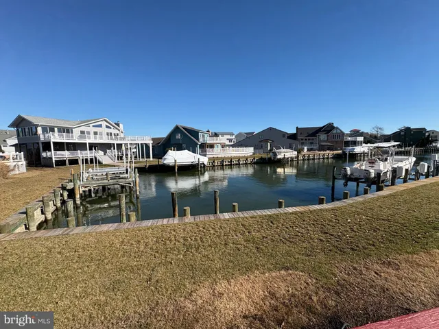 a view of houses with outdoor space and lake view
