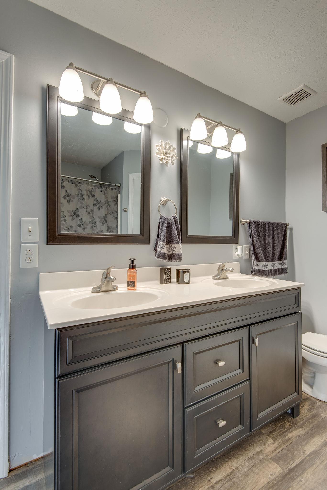 4475 Blackman Road Murfreesboro, TN 37129 - Photo 11 of 15 MASTER BEDROOM WITH UPDATED VANITY, TWO SINKS, UPDATED MIRRORS, AND LIGHT FIXTURE.