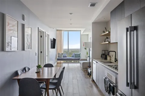 a kitchen with refrigerator cabinets and wooden floor