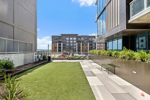 a swimming pool with outdoor seating and yard