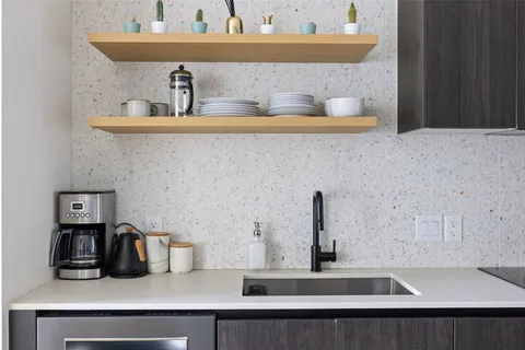 a kitchen with a sink and cabinets