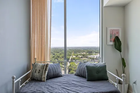 a room with a bed and wooden floor