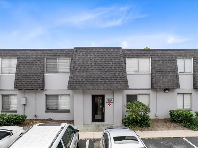 a front view of a house with yard
