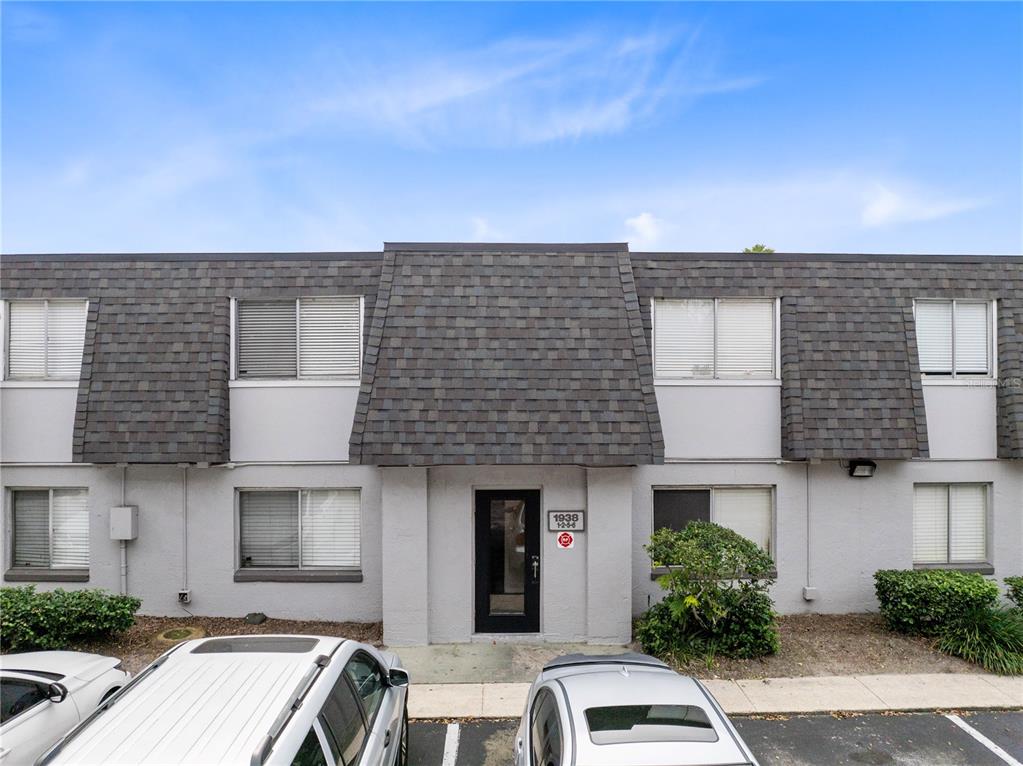 1938 South Conway Road, Unit 5 Orlando, FL 32812 - Photo 1 of 21 a front view of a house with yard