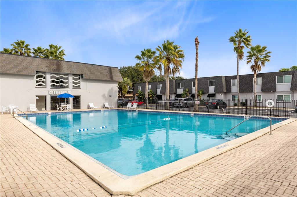 1938 South Conway Road, Unit 5 Orlando, FL 32812 - Photo 16 of 21 a view of a swimming pool with a patio