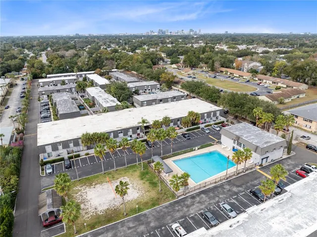 an aerial view of residential houses with outdoor space