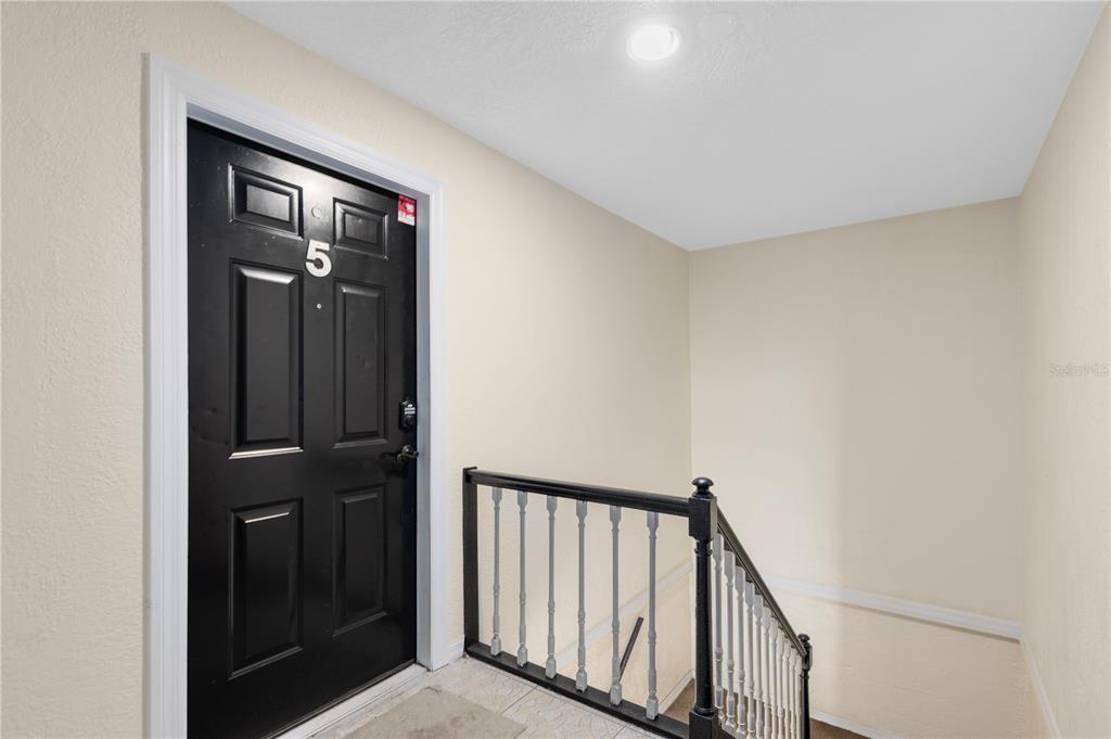 1938 South Conway Road, Unit 5 Orlando, FL 32812 - Photo 2 of 21 a view of a hallway with wooden floor and entryway