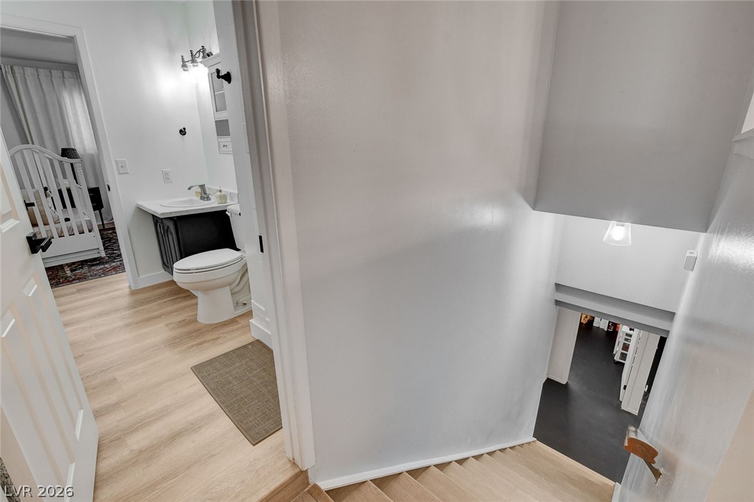 3765 Berkeley Street Logandale, NV 89021 - Photo 45 of 87 This interior image showcases a well-appointed bathroom and a glimpse of the inviting adjacent spaces.