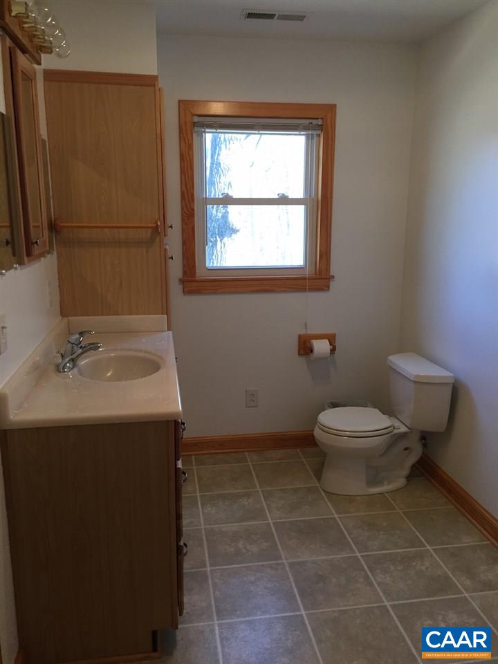 1987 Arrowhead Valley Road Charlottesville, VA 22903 - Photo 11 of 23 a bathroom with a toilet sink and mirror