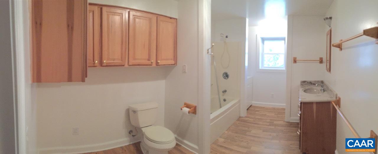 1987 Arrowhead Valley Road Charlottesville, VA 22903 - Photo 15 of 23 a bathroom with a toilet and a shower curtain
