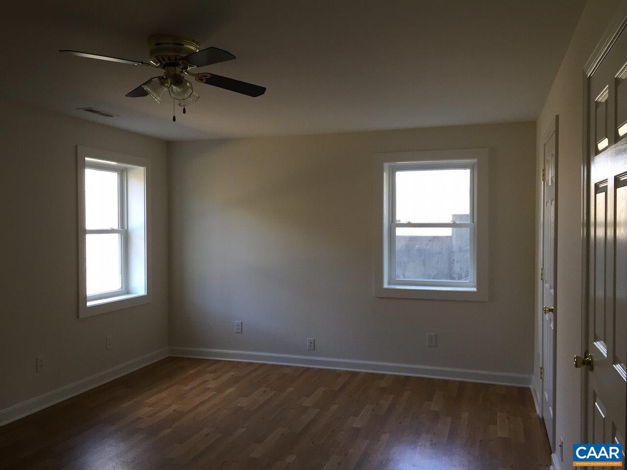 1987 Arrowhead Valley Road Charlottesville, VA 22903 - Photo 17 of 23 an empty room with a window and a ceiling fan