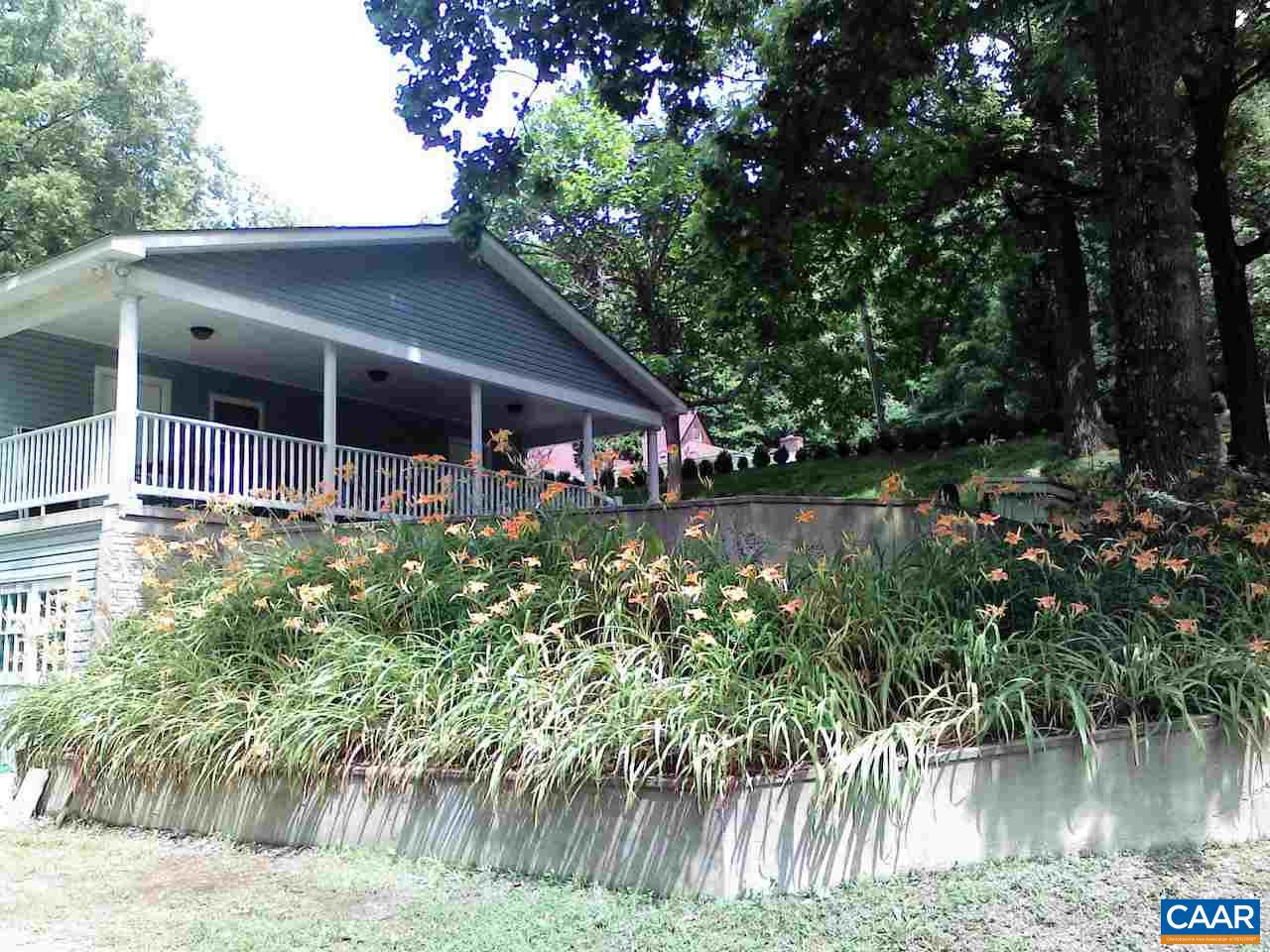1987 Arrowhead Valley Road Charlottesville, VA 22903 - Photo 19 of 23 a front view of a house with a yard and potted plants