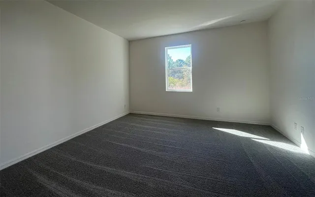 an empty room with a empty space and window