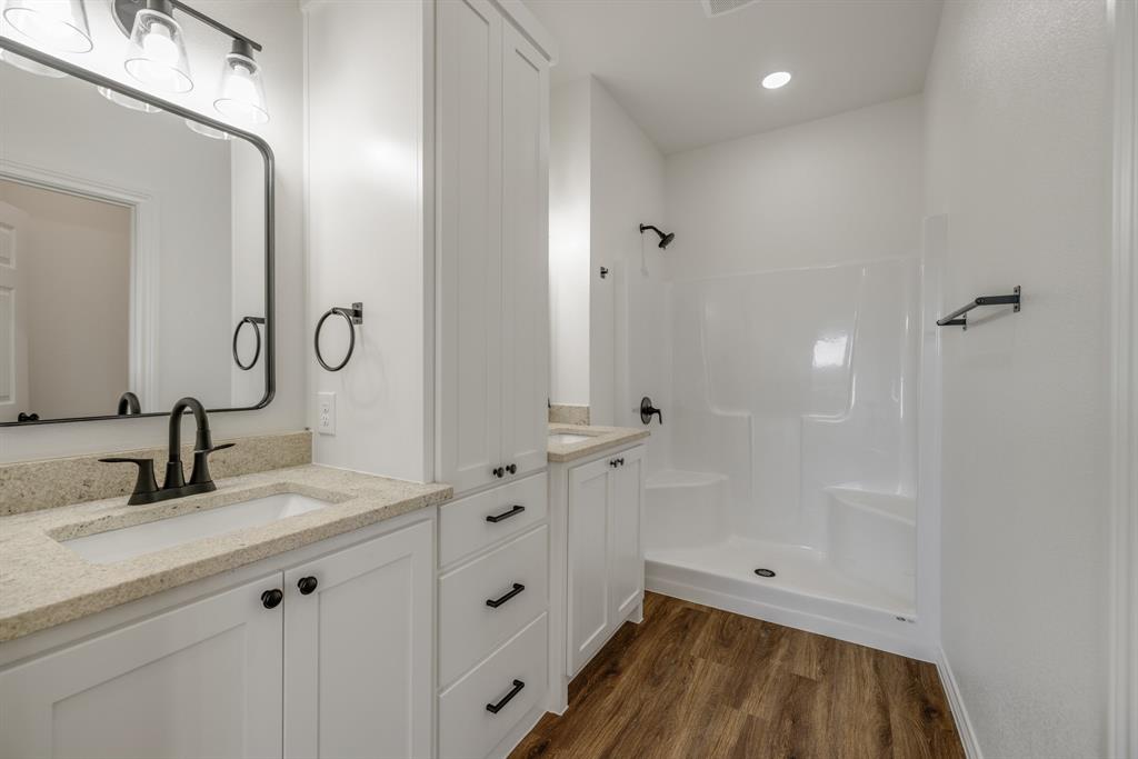 900 Ruger Drive Clyde, TX 79510 - Photo 9 of 11 a bathroom with a sink and a mirror
