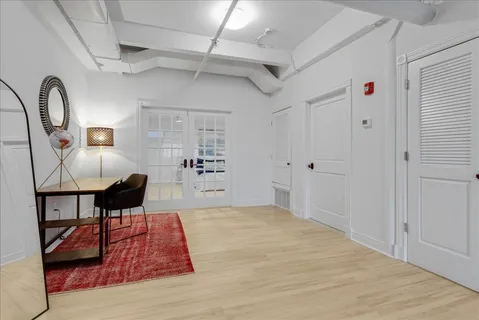 a bed room with a bed and a mirror