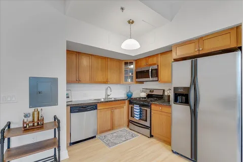 a stove top oven sitting inside of a kitchen