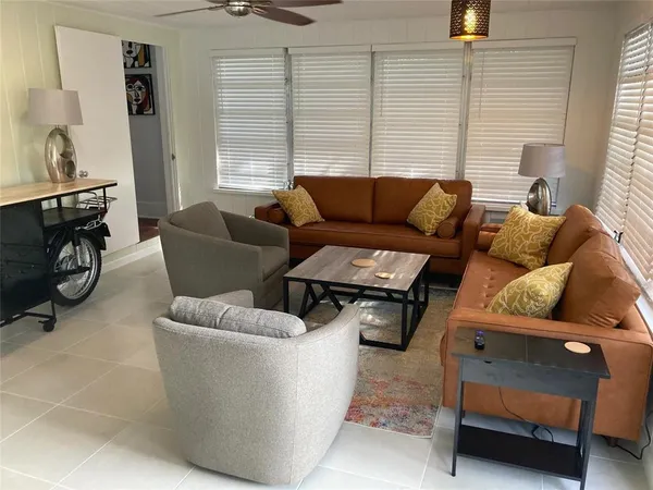 a living room with furniture and a window