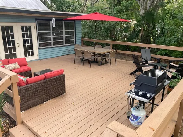 a view of outdoor sitting area with furniture